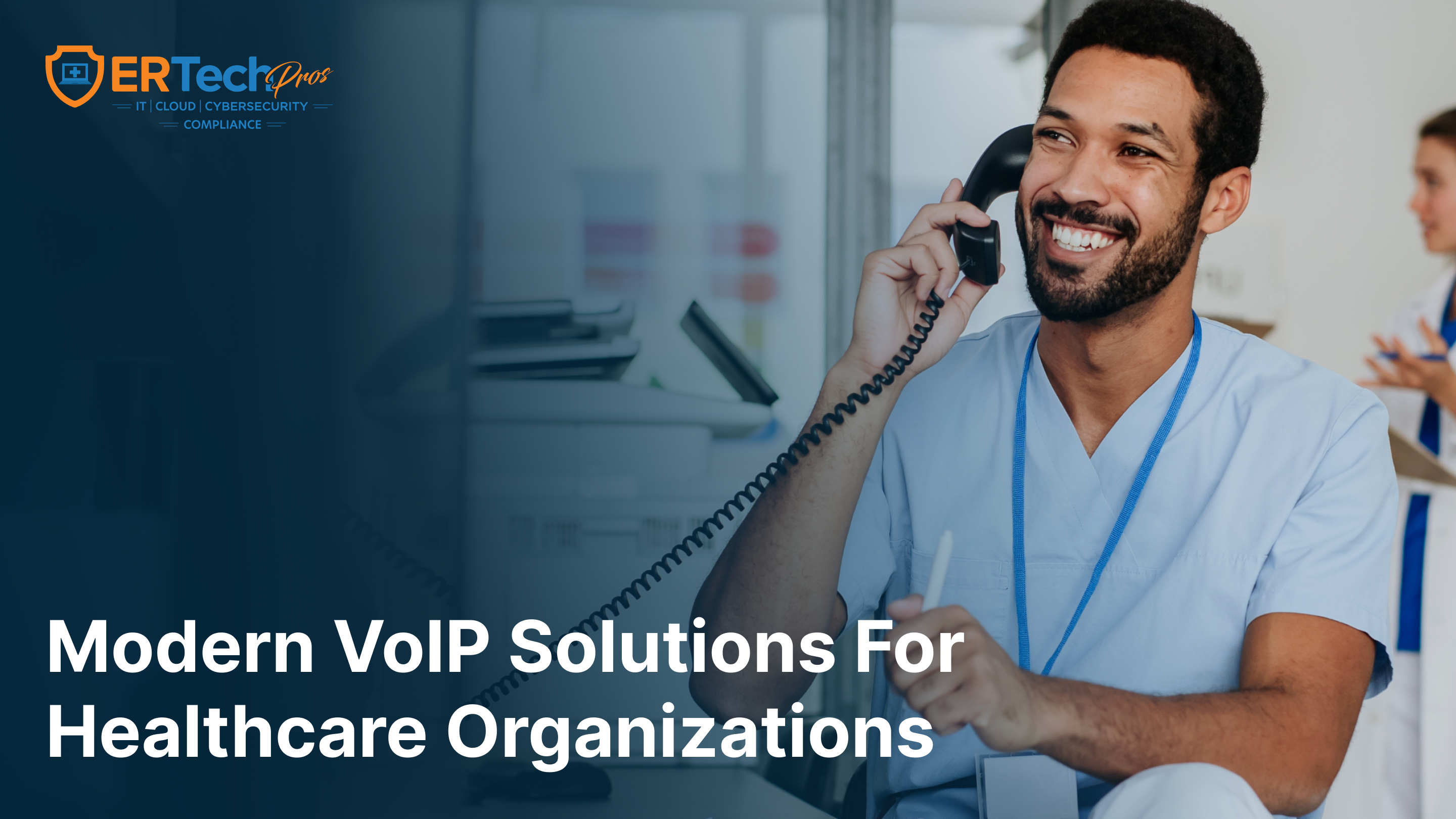 A business owner uses a VoIP phone while reviewing call management tools on their computer.